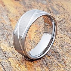 a wedding band that has been made to look like it is in the middle of a rock