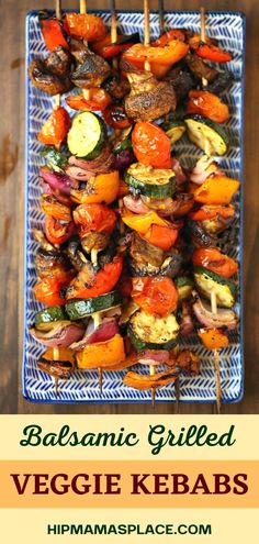 a blue plate topped with veggie kebabs