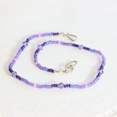 Amethyst Purple Crystal Plum Seed Beaded Wrap Anklet Or Bracelet Handmade Item Length: 9.5 Inches Materials: Seed Beads And Crystals Gemstone: Amethyst Closure: Hook Jewelry Style: Minimalist Amethyst Is A Meditative And Calming Stone Which Works In The Emotional, Spiritual, And Physical Planes To Promote Calm, Balance, And Peace. It Is Also Used To Eliminate Impatience. It Is One Of The Stones That Was Most Highly Prized In The Ancient World, And Continues To Be Prized By Many People Today. #An Adjustable Purple Beaded Bracelet With Beaded Chain, Adjustable Purple Beaded Chain Bracelet, Adjustable Purple Beaded Chain Bracelets, Adjustable Purple Anklets As Gift, Adjustable Purple Anklets, Handmade Purple Anklets As Gift, Adjustable Lavender Beaded Necklaces, Adjustable Single Strand Lavender Beaded Necklace, Adjustable Lavender Single Strand Beaded Necklace