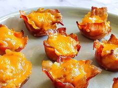 some bacon wrapped in cheese on a plate