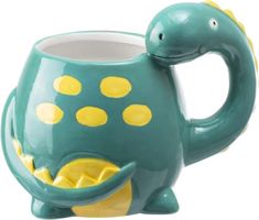 a ceramic mug shaped like a turtle with yellow dots on it's body and neck