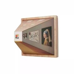 a shelf that has pictures on it and some magnets attached to the back of it