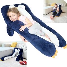 a woman sitting on top of a giant stuffed animal pillow with a child laying on it