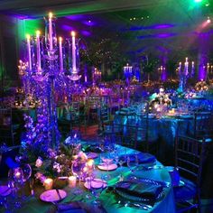 an image of a party setting with purple and blue lighting on the tables in the center