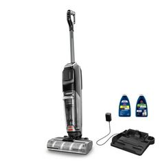 a vacuum and cleaning supplies on a white background