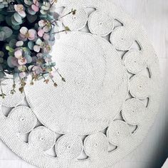 a white rug with circles and flowers on it