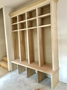 an unfinished bookcase in the process of being built