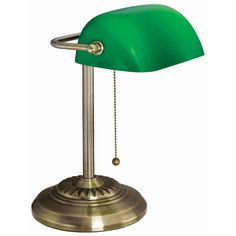 a green desk lamp on a metal base