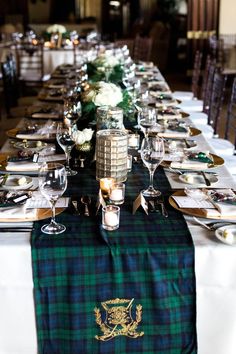 a long table is set with place settings and silverware for the guests to enjoy