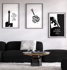 three black and white posters hang on the wall above a couch in a living room