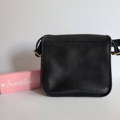 "Vtg Classic Coach NYC Stewardess Bag Navy leather (almost black) with brass hardware Roomy interior with inner zip pocket, outer full slip pocket and a small slip pocket Covered by a flap and secured with a turnlock Original hangtag and chain Adjustable 31\" strap at longest Measures: 11\"L, 11\"H, 3\"W Made in New York, USA #384-3612 Cleaned, conditioned and ready to wear! Questions? Just ask More vtg coach styles/colors also available G144" Classic Black Flap Shoulder Bag, Classic Flap Bag With Gold-tone Hardware, Vintage Crossbody Work Bags, Black Flap Saddle Bag For Formal Occasions, Black Formal Flap Saddle Bag, Black Shoulder Bag With Coin Pocket For Travel, Classic Saddle Bag For Everyday Use, Black Leather Shoulder Bag With Coin Pocket, Classic Travel Flap Bag With Gold-tone Hardware