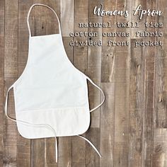 a white apron with the words women's apron on it next to a wooden background