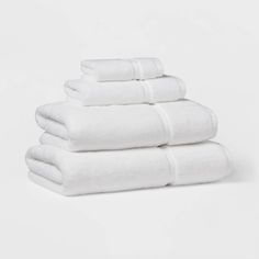 six white towels stacked on top of each other