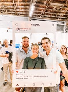 two men and a woman standing in front of a white poster with the words instagram on it