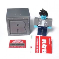 a lego figure next to a box and some stickers