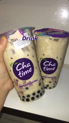 two drinks are being held up in front of each other with the label drink cha time