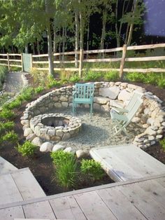 an outdoor fire pit with chairs around it