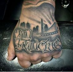 a man's hand with a tattoo on it that says san francisco in the middle