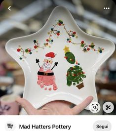 someone is holding up a christmas star dish