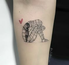 a woman's arm with a small tattoo of a man kneeling down on the ground