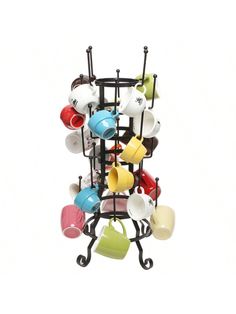 a rack with cups and saucers on it, hanging from the ceiling in front of a white background