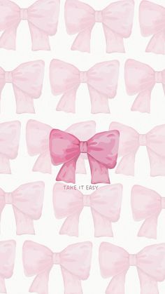 pink bows with the words take it easy written on them in black ink, against a white background