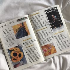 an open book with pictures of sunflowers and other things in it on a bed