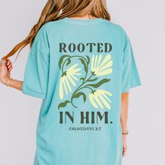 Rooted in Him Tee Christian Comfort Colors Shirt Colossians 2:7 Bible Verse Shirt Retro Floral Christian Women's Faith Based Apparel Baptism This Christian Comfort Colors shirt features a retro flower graphic on the back of the shirt with the text "Rooted in Him" based on Colossians 2:7. The front of the shirt is plain. A stylish way to showcase your faith, this tee would also make a great baptism gift for women! ✿ The With A Wildflower mission is to give God the glory and give back through a on Christian Comfort, Give God The Glory, Luke 12 27, Colossians 2, Jesus Clothes, Faith Based Clothing, Bible Verse Shirt, Christian Tees, Women Of Faith