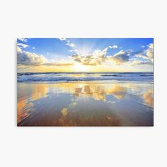 the sun shines brightly through clouds over the ocean on a sunny day at the beach