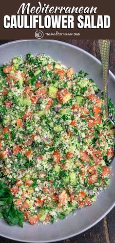 a bowl filled with salad on top of a wooden table