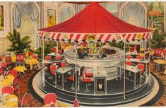 an old photo of a carousel restaurant with red and white striped awnings on the ceiling