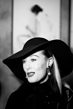 black and white photograph of a woman wearing a hat