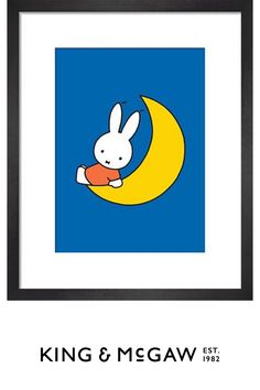 a rabbit sitting on top of a crescent in front of a blue and yellow background