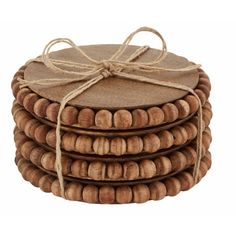 four wooden coasters tied with twine and string, stacked on top of each other