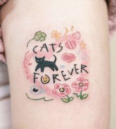 a woman's thigh with tattoos on it that says cats are forever and has an image of a cat in the center