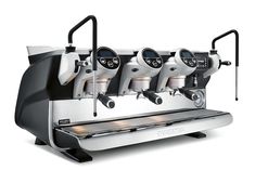 two groups of espresso machines sitting next to each other on a white background