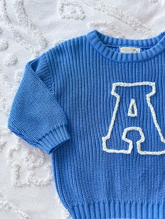 Personalized chunky knit sweater for babies, toddlers, and children. This listing has three color selections. All sweaters are hand embroidered. Sweaters are perfect for birthdays, birth announcements, gifts, and holiday photos. The sweater can be customized with yarn colors.  If you would like flowers or any other small design like the bear added please add listing https://littlejoythreadsco.etsy.com/listing/1783735624 to your cart with this listing. Blue Fall Sweater With Letter Embroidery, Winter Varsity Sweater With Letter Embroidery, Blue Casual Sweater With Letter Embroidery, Boys Sweater With Name, Boys Embroidered Sweater, Varsity Letter, Pull Bebe, Chunky Knits Sweater, Holiday Photos