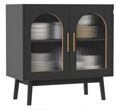 a black cabinet with glass doors and gold accents