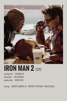 the poster for iron man 2 is shown with two men sitting at a table talking