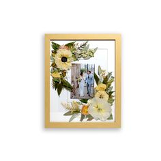 a photo frame with flowers and greenery on the front, hanging on a wall