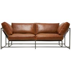 a brown leather couch sitting on top of a metal frame