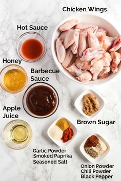 the ingredients for chicken wings are shown in bowls on a marble countertop, including honey, barbecue sauce, brown sugar, garlic powder, and seasoning