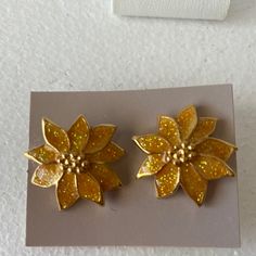 Vintage Avon, Yellow Gold With Glitter Poinsettia Pierced Earrings. These Are New In The Box Of Vintage Airings From The 80s. They Would Make A Great Addition To Your Holiday Earring Collection. Gold Flower Earrings For Festive Occasions, Festive Gold Glitter Jewelry, Avon Jewelry Vintage, Poinsettia Earrings, Yellow Glitter, Earring Collection, Avon Jewelry, Holiday Earring, Vintage Avon