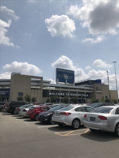 a parking lot with several cars parked in front of it and a sign that says welcome to northfield