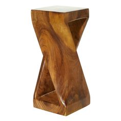 a wooden table with a white top and an unusual shaped design on it's side