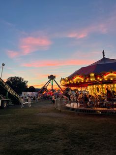 vertical photo of a sunset behind a lit up merry go round and other carnival rides Fair Aesthetic Fall, Small Town Carnival Aesthetic, Rich Small Town Aesthetic, Summer In A Small Town Aesthetic, Carnival Fair Aesthetic, Town Fair Aesthetic, Small Town Events, Small Towns Aesthetic, Small Town Activities