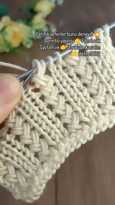 someone is crocheting the side of a piece of yarn