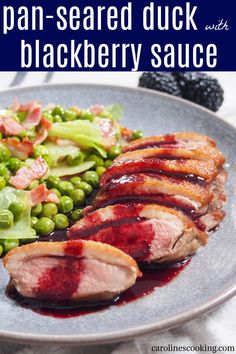 a plate with meat, vegetables and sauce on it that says japan - seared duck with blackberry sauce