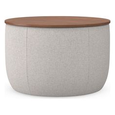 a white and wood stool with grey fabric upholstered on the top, in front of a white background