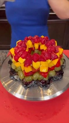 there is a cake with fruit on it